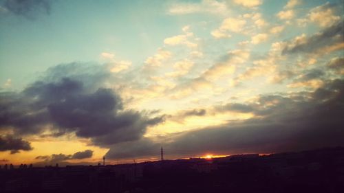 Scenic view of cloudy sky at sunset