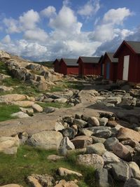 Rocks on landscape against sky