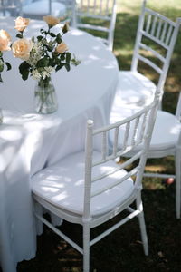 Empty chairs and white table