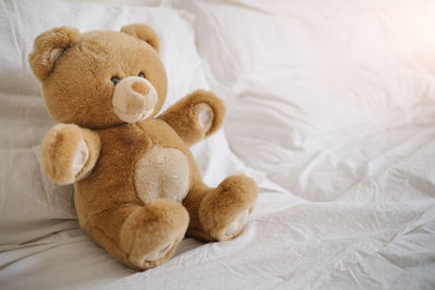 Close-up of stuffed toy on bed