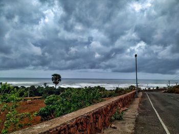 Road by sea against sky
