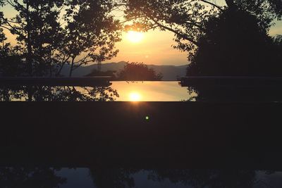 Scenic view of lake at sunset