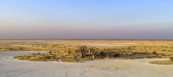 Scenic view of beach against clear sky