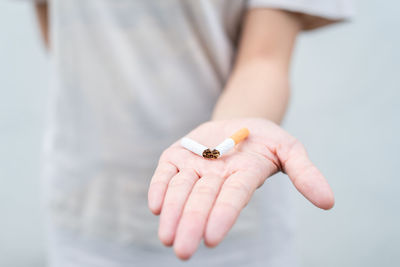 Close-up of man holding hands
