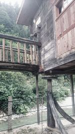 Low angle view of old building in forest