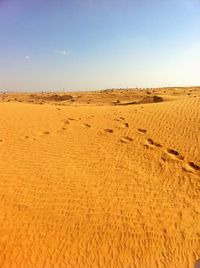 Scenic view of desert against clear sky