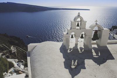 High angle view of church bells against sea