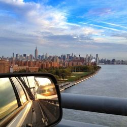 Cityscape against cloudy sky
