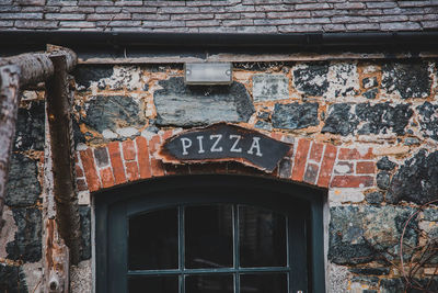 Low angle view of text on building