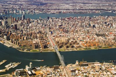 High angle view of manhattan bridge over east river in city