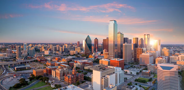 Aerial view of modern buildings in city against sky