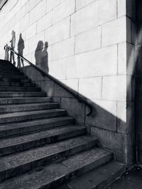 Low angle view of people walking on staircase