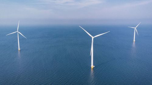 High angle view of wind turbines on field