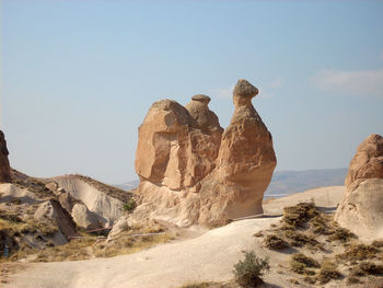 Rock formations in desert against sky