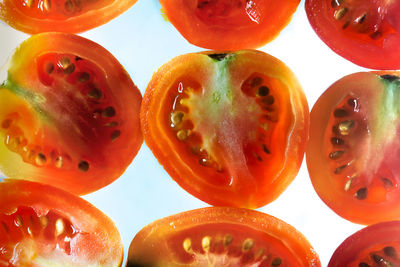 Close-up of oranges against white background