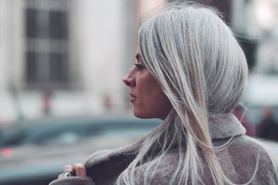 Close-up of young woman looking away