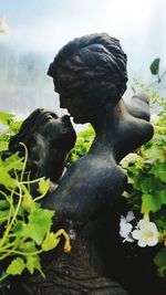 Close-up of statue against black background