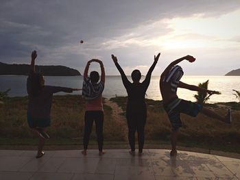 Rear view of woman standing on beach