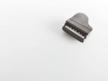 High angle view of electric lamp against white background