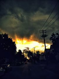 Road against cloudy sky at sunset