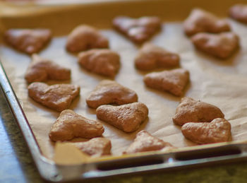Close-up of heart shape cookies in baking sheet