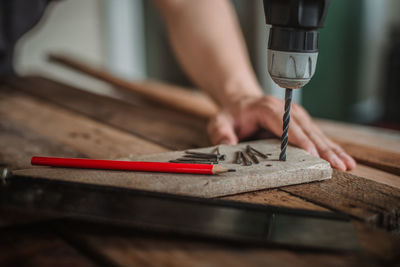 Man working on wooden table