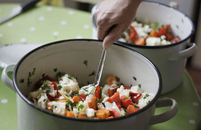 Close-up of woman preparing pickle at home