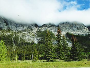 Scenic view of mountains against cloudy sky