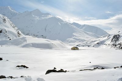 Scenic view of snowcapped mountains against sky