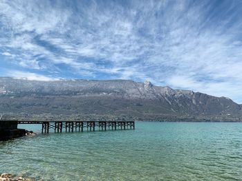 Pier over sea against sky