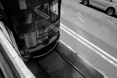 Close-up of car on road