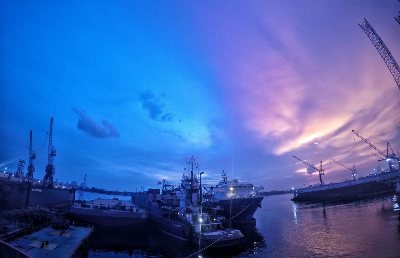 harbor, nautical vessel, sky, water, transportation, moored, mode of transport, crane - construction machinery, cloud - sky, commercial dock, mast, blue, dusk, boat, waterfront, outdoors, nature, no people, cloud, built structure