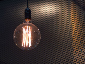 Close-up of illuminated light bulb