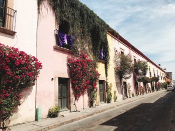 Street by building against sky