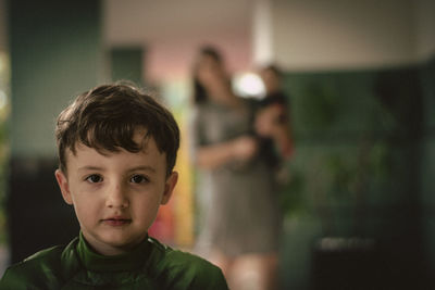 Close-up portrait of cute boy at home