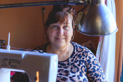 Portrait of smiling woman at home