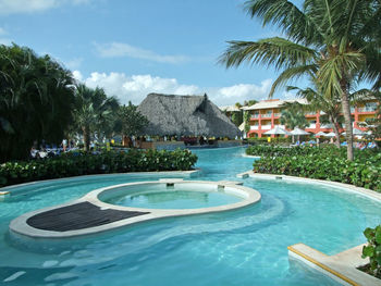 View of swimming pool in yard against sky