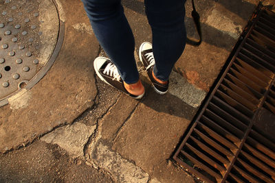 Low section of people walking on footpath