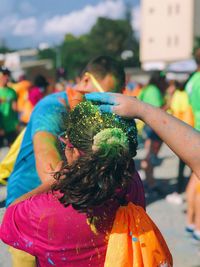 Group of people playing holi in city