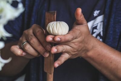 Midsection of man making food