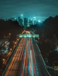 High angle view of light trails on road at night