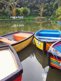 Boats moored in lake