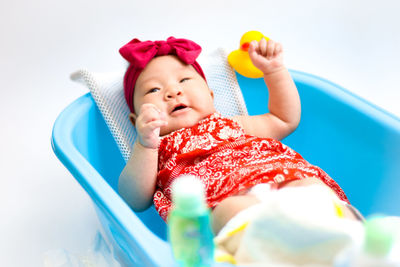 Portrait of cute baby girl looking away