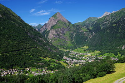 Scenic view of trees and mountains against sky