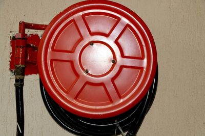 Directly above shot of red telephone on wall