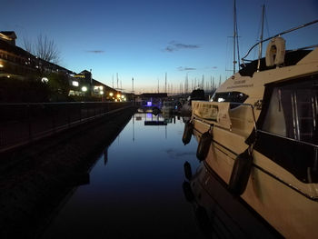 Reflection of sky on boat in canal