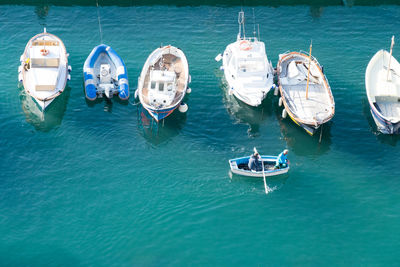 High angle view of sailboats moored in sea