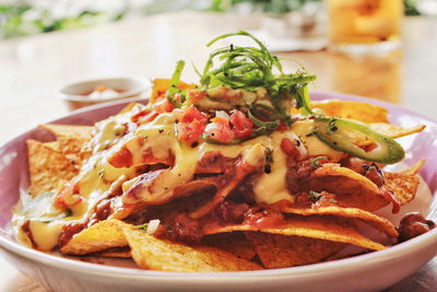 Close-up of nachos in plate on table