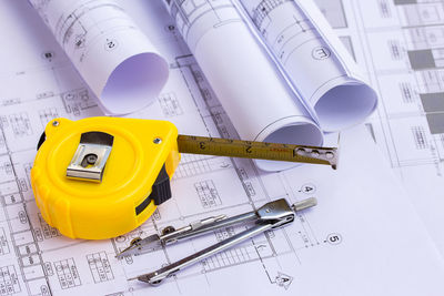High angle view of yellow telephone on table