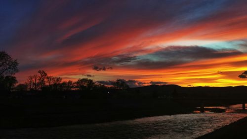 Scenic view of dramatic sky at sunset